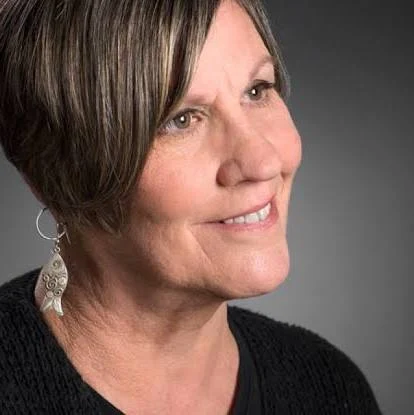 A professional headshot photo of author Sarah Freligh